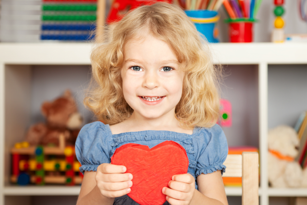 Valentines day activities for EYFS - Young girl holding hearts