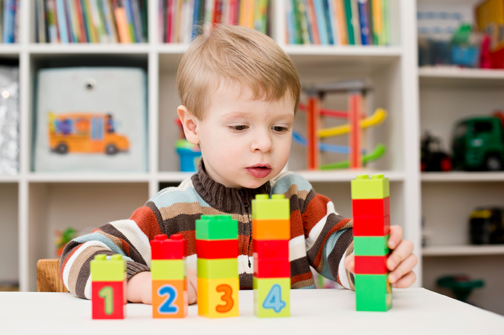 EYFS Maths Activities Toddler Playing With Number Blocks